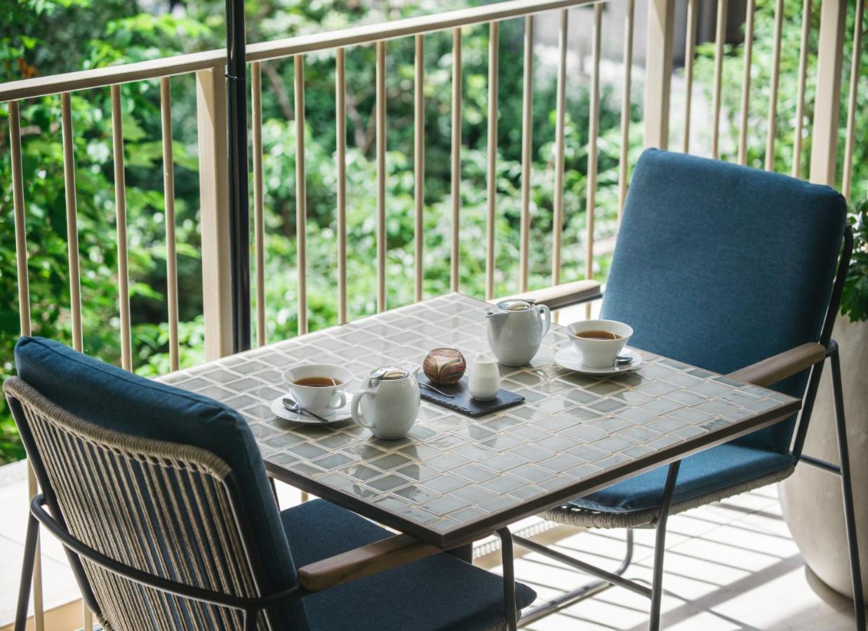 Zentis Osaka Hotel Exterior photo A balcony with a table and chairs